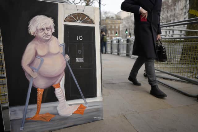 A painting that depicts Britain's Prime Minister Boris Johnson sits at the entrance to Downing Street in London. Picture: AP Photo/Kirsty Wigglesworth