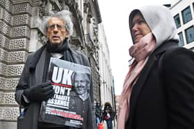 Piers Corbyn (left) outside the Old Bailey, London, ahead of a judgement in the Julian Assange extradition case. Wikileaks founder Assange, 49, faces an 18-count indictment, alleging a plot to hack computers and a conspiracy to obtain and disclose national defence information.
