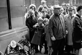 Crowds file past the war memorial in Edinburgh's Royal Mile on Remembrance Day in 1968.