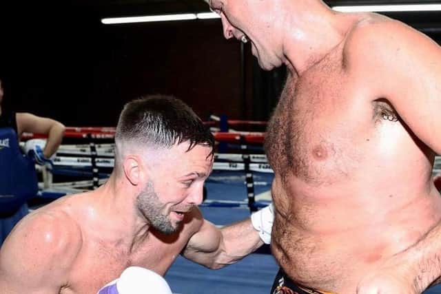 Josh Taylor delivers some body shots into the Gipsy King.