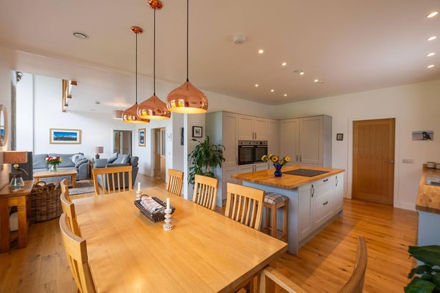 The dining area in the large open plan living area is situated between the kitchen and living room.