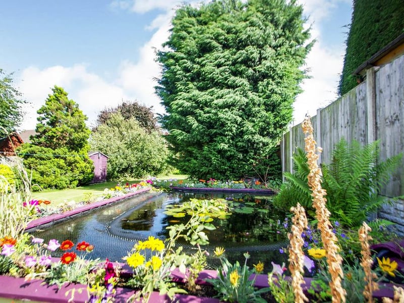 The gardens at this Big Barn Lane property have to be seen to be believed. Specifically, this amazing fishpond in the mature back garden.