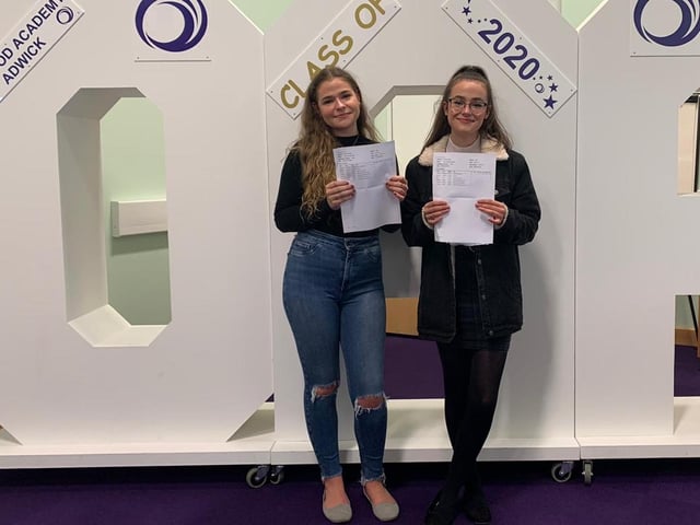 Evie and Faye Mountain with their A level results at Outwood Academy Adwick