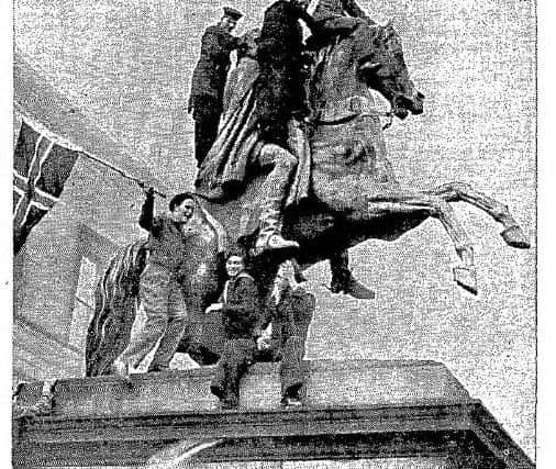 Jubilant scenes were witnessed outside Register House where Army, Navy and RAF revellers 'mounted' the Wellington statue.