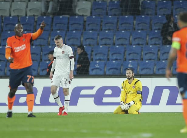 Hearts goalkeeper Craig Gordon sits on the ground after his mistake led to Basaksehir's Serdar Gurler scoring his side's second goal. Picture: AP