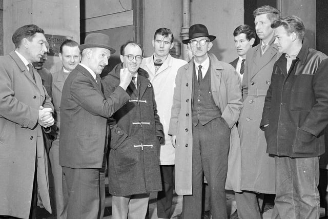 Amal Union of Building Trade Workers talk to officials and shop stewards during a builders stike at Muirhouse in November 1962.