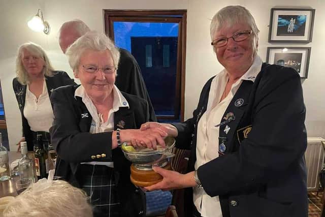 Liz McLellan from Armadale (right) presents the Scotland top rod trophy to Jane Wright after the Home International. Picture contributed by Liz McLellan