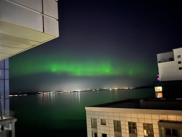 The mysterious green lights were reflected in the water of the Western Harbour in Newhaven, Edinburgh.