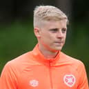 Alex Cochrane is on loan at Hearts from Brighton.
