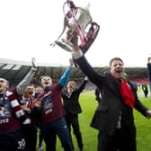 Hearts manager Paulo Sergio lifts the Scottish Cup after a 5-1 win over Hibs in 2012.