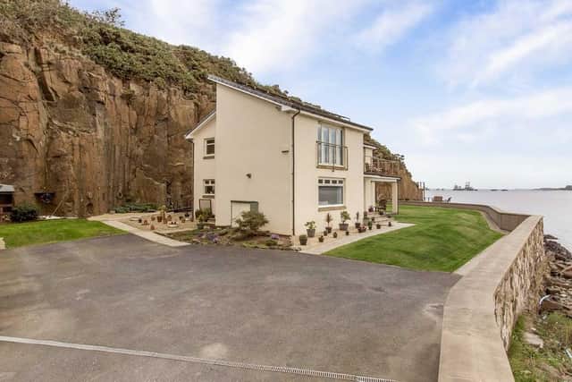 The stunning 4-bedroom home sits on the bank of the River Forth, just metres away from one of Scotland’s most iconic landmarks - the Forth Bridge.
