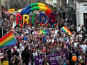 Pride marchers march up the Royal Mile in Edinburgh. Photo: Andrew Milligan/PA.