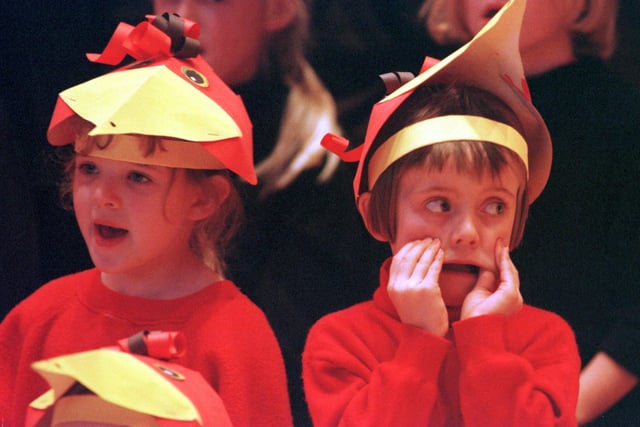We all remember getting bored during our school’s nativity play - here we can see one kid finding a way to keep themselves entertained. Picture: 11 December 1998