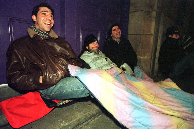 Keen locals sat under a blanket, as they waited in the queue for Hogmanay tickets in 1998.