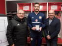 Craig Gordon received his 50th cap medal from Willie Miller and SFA chairman Alan McRae at Pittodrie in 2017. Picture: SNS