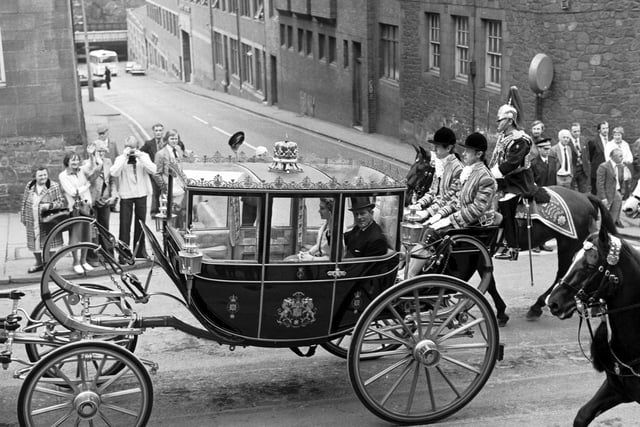The Queen and Prince Philip travel up the Royal Mile  to St Giles cathedral in the Scottish State Coach during their May 1977 Silver Jubilee visit to Edinburgh.