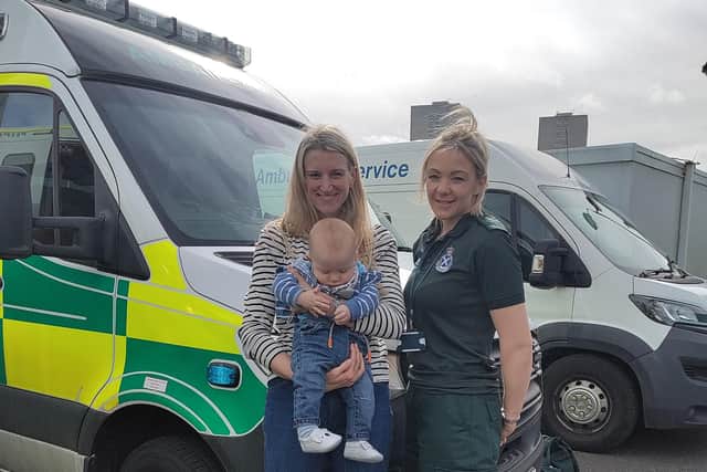 Photo issued by Scottish Ambulance of Alex Clayton (centre-left) and Sone Clayton (centre) meeting up with ambulance service call handler Lorna Milward (right), who helped deliver baby Fraser.