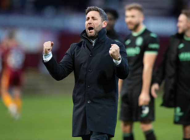 Manager Lee Johnson celebrates after Hibs defeated Motherwell at Fir Park on Sunday. Picture: SNS