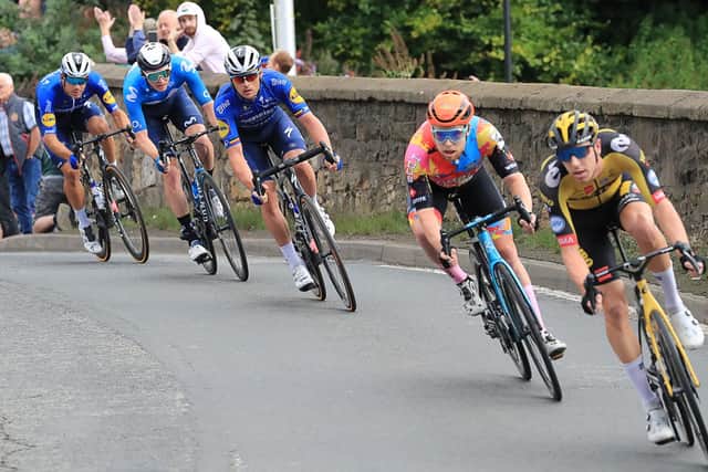 Stage winner Yves Lampaert (centre) crossing the bridge over the North Esk in Lasswade. Pic: Joe Gilhooley