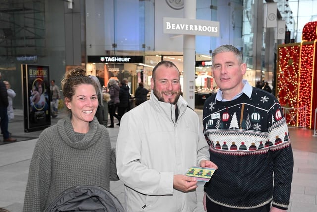 These happy shoppers picked up a gift card for the Centre in Livingston last week ahead of Christmas Day.