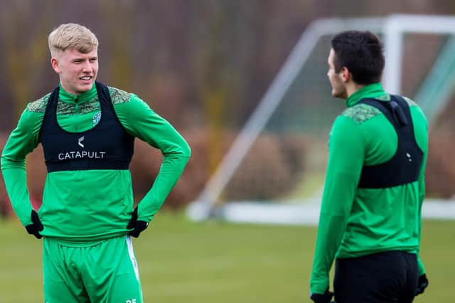 Josh Doig deep in discussion with Kyle Magennis at the Hibernian Training Centre
