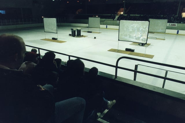 Hibs fans gathered to watch a Scottish Cup tie against Stenhousemuir on screens at Murrayfield Ice Rink on 3rd March 1995.