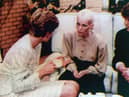 Diana, Princess of Wales, has tea with Sally Miles, 26, a resident at Milestone House, the UK's first purpose-built Aids hospice (Picture: PA)
