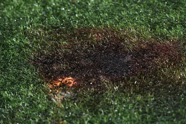 The damage on the synthetic pitch at New Douglas Park after the pyrotechnic was removed. Picture: SNS