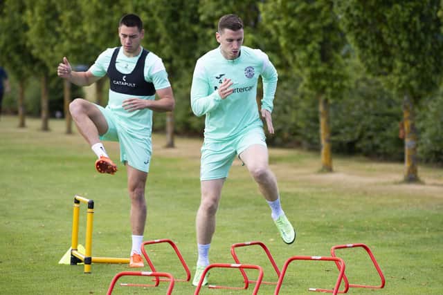 Defensive pair Lewis Miller, left, and Paul Hanlon are put through their paces at training