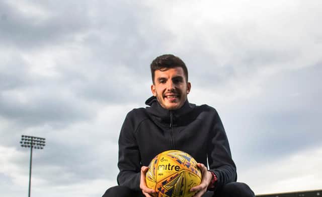 Mihai Popescu has signed a two-year deal with Hearts.