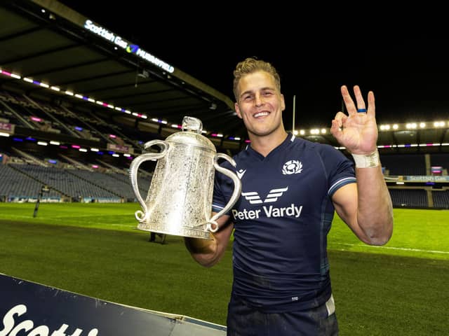 Scotland's Duhan van der Merwe celebrates at full-time with the Calcutta Cup after his hat-trick in the 31-20 win over England at Scottish Gas Murrayfield. (Photo by Craig Williamson / SNS Group)