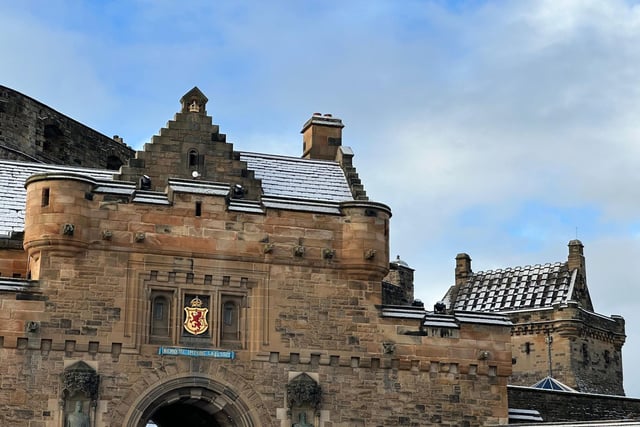 Snow dusted the roof-tops of Edinburgh Castle, above the city's coat of arms.