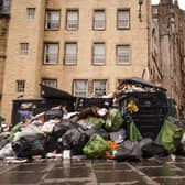 Rubbish bags lie next to overflowing bins in Edinburgh's Grassmarket (Picture: Peter Summers/Getty Images)