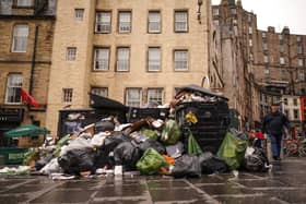 Rubbish bags lie next to overflowing bins in Edinburgh's Grassmarket (Picture: Peter Summers/Getty Images)