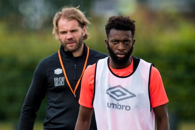 Beni Baningime (pictured) with Hearts manager Robbie Neilson