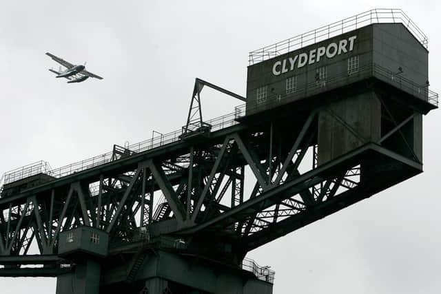 The Allseas Pioneer cargo ship has arrived in Clydeport from China, bringing textiles, furniture and toys for sale in Scotland, and will depart more than a million bottles of whisky (Picture: Andrew Milligan/PA)
