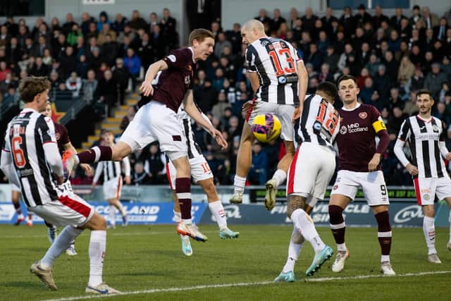 Kye Rowles has a headed attempt during the first half of Hearts' 1-1 draw with St Mirren in Paisley. Picture: SNS