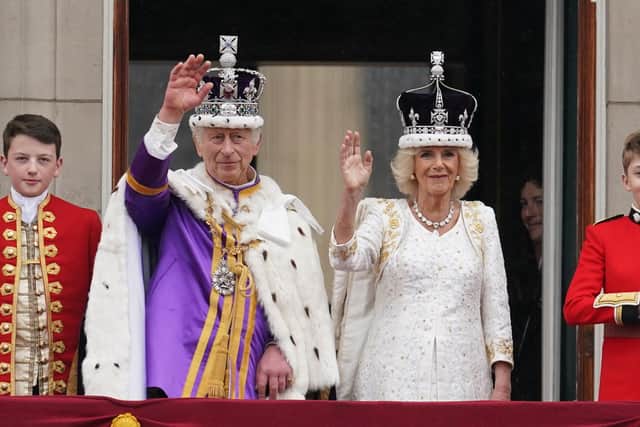 King Charles III and Queen Camilla on the balcony of Buckingham Palace, following the coronation (Picture: Owen Humphreys/PA Wire)