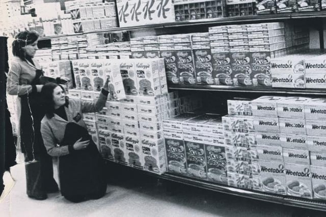 Checking the stock at the new store 44 years ago. Can you spot someone you know?