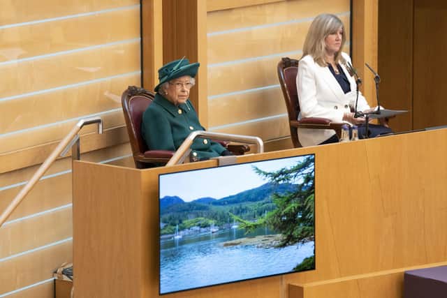 The Queen and Presiding Officer Alison Johnstone in the debating chamber of the Scottish Parliament.