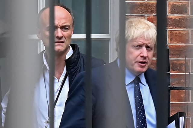 Boris Johnson and his then special advisor Dominic Cummings leave from the rear of Downing Street in 2019 (Picture: Daniel Leal/AFP via Getty Images)