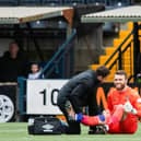 Hearts goalkeeper Zander Clark receives treatment against Kilmarnock.