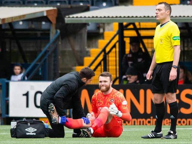 Hearts goalkeeper Zander Clark receives treatment against Kilmarnock.