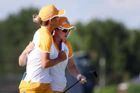 Mel Reid and Leona Maguire celebrate securing a half point in the penultimate session in the 17th Solheim Cup in Toledo, Ohio. Picture: Gregory Shamus/Getty Images.