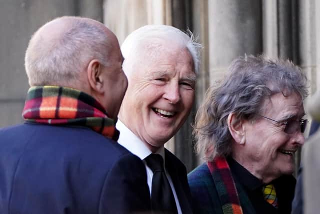 Former Scottish boxer and commentator Jim Watt (centre), arriving ahead of a memorial service for former boxer Ken Buchanan at St Giles' Cathedral, Edinburgh. The Scottish boxing great, who became the undisputed world lightweight champion in 1971, died at the beginning of the month, aged 77. Picture date: Tuesday April 25, 2023. PA Photo. See PA story MEMORIAL Buchanan. Photo credit should read: Andrew Milligan/PA Wire.
