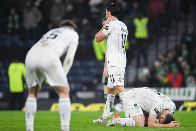 The Hibs players are dejected at full time of the Premier Sports Cup final against Celtic at Hampden Park