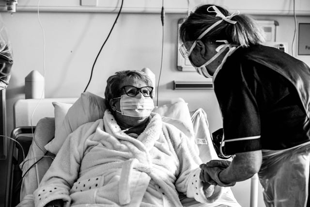 Senior staff nurse, Donna Read cares for Brenda Carroll as her treatment for coronavirus continues.