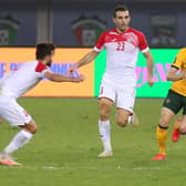 Martin Boyle takes on the Jordanian defence during the 2022 FIFA World Cup qualification group B football match between Australia and Jordan at the Kuwait Sports Club in Kuwait City