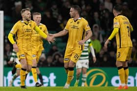 Nicky Devlin celebrates with teammates after making it 2-1 during at Celtic Park on his 100th appearance for Livingston. Picture: Craig Williamson / SNS