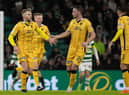 Nicky Devlin celebrates with teammates after making it 2-1 during at Celtic Park on his 100th appearance for Livingston. Picture: Craig Williamson / SNS